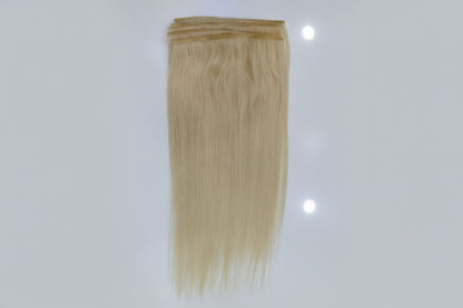 Blonde hair extensions on a white background